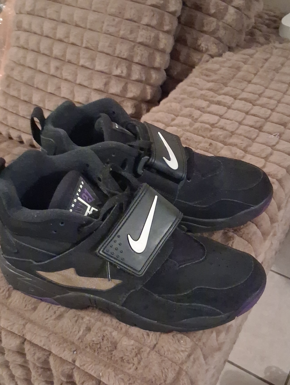 Nike Men’s Black Sneakers with White Swoosh and Gold Accent